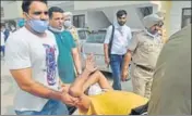  ?? GURMINDER SINGH/HT ?? ■ John Buttar being taken away by police after the encounter at
Aman Homes in Sunny Enclave, Kharar.