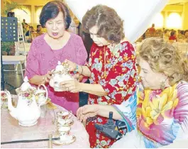  ??  ?? Catholic Women’s Club (CWC) president Baby Gloria, Annual Tea Party chairperso­n Carrie Bautista and Celia Diaz Laurel