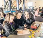  ?? Roberto Gonzalez TNS ?? CIARA PAGAN, Kamila Cruz and Josselyn Banegas at a code camp offered by a Florida Boys & Girls Club.