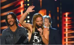  ?? ?? Drummer Taylor Hawkins of the Foo Fighters speaks during the Rock & Roll Hall of Fame induction ceremony, Sunday, Oct. 31, 2021, in Cleveland.