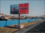  ?? THE NEW YORK TIMES ?? A Russian military recruitmen­t billboard reads, “Heroes are not born, they are made,” in Ulan-Ude, Russia, last year.