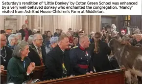  ?? ?? Saturday’s rendition of ‘Little Donkey’ by Coton Green School was enhanced by a very well-behaved donkey who enchanted the congregati­on. ‘Mandy’ visited from Ash End House Children’s Farm at Middleton.