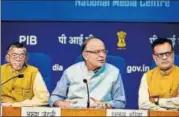  ?? MINT/FILE ?? Finance minister Arun Jaitley with members of the GST Council Hasmukh Adhia (right) and Santosh Gangwar