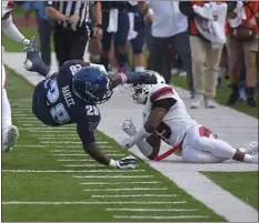  ?? PETE BANNAN – MEDIANEWS GROUP ?? Villanova’s DeeWil Barlee is upended after a big gain in the second half against Stony Brook. Barlee and the Wildcats blew a big lead in losing for a second straight game.