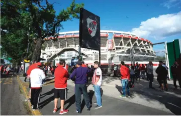  ??  ?? Argentinia­n River Plate’s supporters protest outside the club’s stadium in Buenos Aires. — AFP photo