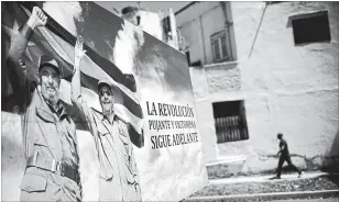  ?? RAMON ESPINOSA THE ASSOCIATED PRESS ?? A poster of Fidel Castro and Raul Castro in Havana, Cuba. The Cuban government has selected Miguel Díaz-Canel Bermúdez as the new president.