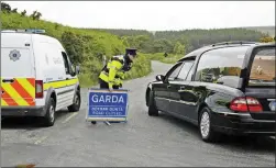  ??  ?? A hearse arrives at Military Road to collect the remains of Patricia O’Connor in June 2017.