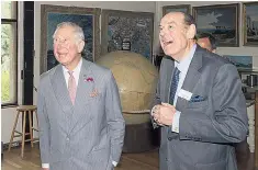  ??  ?? The Prince admires the art with Sir Nicholas Soames in Sir Winston’s garden studio