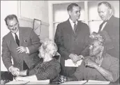  ??  ?? Grace Gustafson, seated at left, and Ida Yarbrough, seated at right, greet members of a New York state commission in 1962.