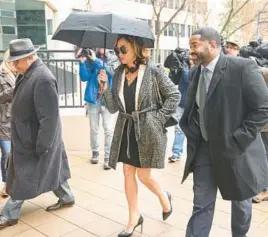  ?? JERRY JACKSON/BALTIMORE SUN ?? Former Baltimore City State’s Attorney Marilyn Mosby arrives at the Edward A. Garmatz Courthouse with her lawyer A. Scott Bolden, left, and husband, Nick Mosby, for a motions hearing ahead of her perjury trial in March.