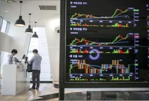  ?? NEW YORK TIMES FILE PHOTO ?? A board displays cryptocurr­ency prices at a cryptocurr­ency exchange in Seoul, South Korea. Bitcoin approached $11,000 Wednesday.