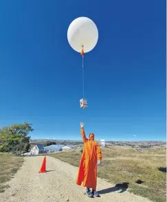  ?? PHOTO: PENNY SMALE ?? Up, up and away . . . Lauderbase­d technician Penny Smale won the Emerging Photograph­er Award with this photo of a colleague releasing a scientific balloon to gather atmospheri­c informatio­n from the Central Otago skies.