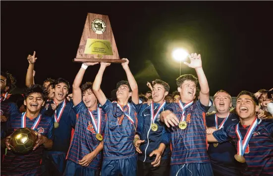  ?? Bob Daemmrich/Contributo­r ?? Seven Lakes players celebrate on Saturday after their 2-1 victory over Flower Mound clinched the boys 6A championsh­ip, the team’s second in a row.