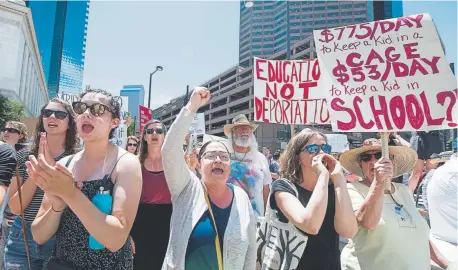  ?? Andy Colwell, Special to The Denver Post ?? Protesters chant outside the office of Republican U.S. Sen. Cory Gardner at the Byron G. Rogers Federal Building at 19th and Stout streets during a rally July 2. They were demonstati­ng against the separation of families and children detained at the Mexican border by the federal government.