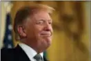  ?? JACQUELYN MARTIN — THE ASSOCIATED PRESS ?? President Donald Trump winks during the annual presentati­on of a bowl of shamrocks with Irish Prime Minister Leo Varadkar, Thursday in the East Room of the White House in Washington.