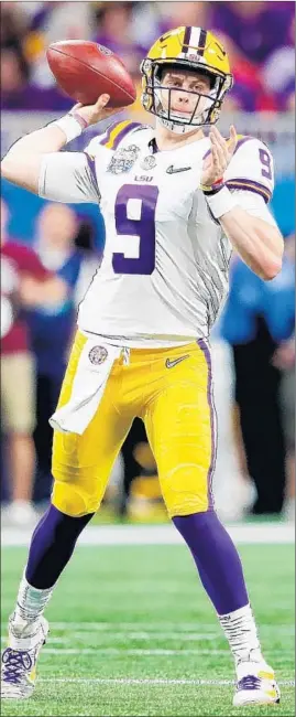  ?? KEVIN C. COX/GETTY ?? Joe Burrow threw for seven TDs and ran for another score in leading LSU to a win Saturday.