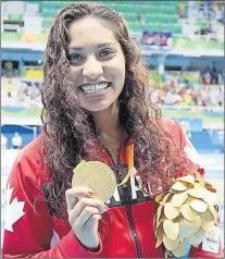  ?? SCOTT GRANT PHOTO ?? Katarina Roxon of Kippens, shown here displaying the gold medal she won at the 2016 Paralympic Games in Rio de Janeiro last summer, no longer wants a part of the Sport Newfoundla­nd and Labrador awards program.