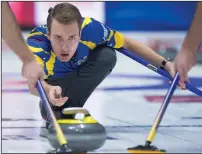  ?? CP PHOTO ANDREW VAUGHAN ?? Alberta skip Brendan Bottcher delivers a rock as they play Northwest Territorie­s at the Tim Hortons Brier curling championsh­ip at the Brandt Centre in Regina on Sunday.