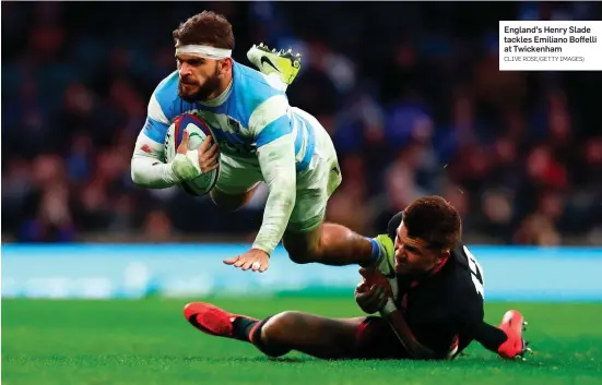  ?? CLIVE ROSE/GETTY IMAGES) ?? England’s Henry Slade tackles Emiliano Boffelli at Twickenham