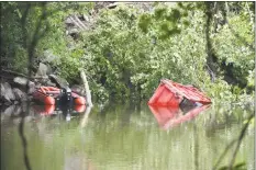  ?? Kendra Baker / Hearst Connecticu­t Media ?? A driver was killed and another was injured on Tuesday morning in a crash that sent a dump truck into the Housatonic River in New Milford.