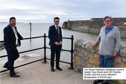  ??  ?? Cllr Stuart Baldwin, Bridgend council leader Huw David and Cllr Charles Smith visit the iconic Western Breakwater at Porthcawl.