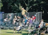  ??  ?? Fans at Lakewood Park in Norfolk watch the Old Dominion Hitters play the Greenbrier Knights in a Tidewater Summer League game Thursday.