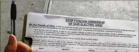  ?? COLUMBUS DISPATCH ?? The petition — paid for by Ohioans For Energy Security — being circulated calls on lawmakers to stop foreign ownership of Ohio’s electric grid.