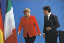  ?? Sean Gallup / Getty Images ?? German Chancellor Angela Merkel and Italian Prime Minister Guiseppe Conte hold talks in Berlin on the immigratio­n issue.