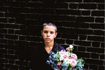  ??  ?? Top Untitled, London (‘Romeo and I were waiting to see our sister’s ballet recital and we bought her flowers. I love this picture’).