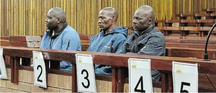  ?? Picture: SUE MACLENNAN ?? FACING THE LAW: Kenneth Chigaweni, 26, Thomas Joao Machele, 53, and Amos Ncube, 44, during a recess on Tuesday November 14. They are on trial in the Makhanda high court, charged with conspiracy to poach rhinos.