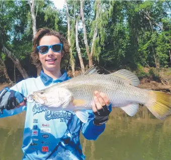  ??  ?? Ziggy Durling with a Daly River barramundi ... "not a monster, but the only keeper we got" said dad Trevor