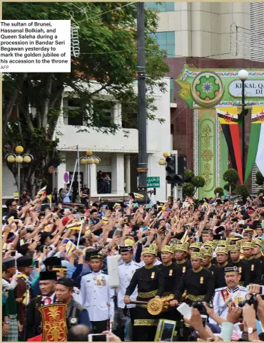  ?? AFP ?? The sultan of Brunei, Hassanal Bolkiah, and Queen Saleha during a procession in Bandar Seri Begawan yesterday to mark the golden jubilee of his accession to the throne