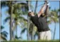 ?? MARCO GARCIA — THE ASSOCIATED PRESS ?? Patton Kizzire drives on the 17th tee during the final round of the Sony Open golf tournament, Sunday in Honolulu.