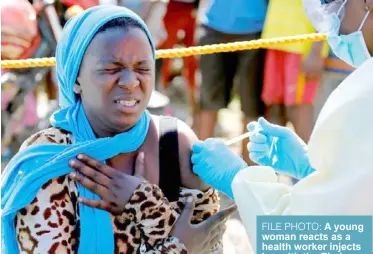  ?? REUTERS. ?? FILE PHOTO: A young woman reacts as a health worker injects her with the Ebola vaccine, in Goma, Democratic Republic of Congo, August 5, 2019.