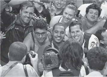  ?? BOB ROSATO, USA TODAY SPORTS ?? Carmelo Anthony, center, wrapped up his Olympic career with a gold medal, his third.