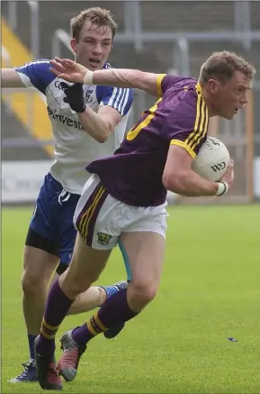  ??  ?? Kevin O’Grady of Wexford on the move as Monaghan’s Jack McCarron challenges.