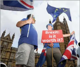  ?? PHOTO: BLOOMBERG ?? Demonstrat­ors hold Union flags, also known as Union Jacks, and EU flags during an anti-Brexit protest outside the Houses of Parliament in London, on Tuesday. Scotland’s bid to ensure that it retains a high degree of authority over local issues after...