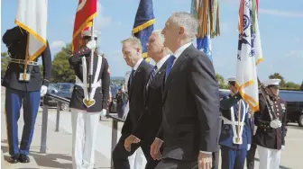  ?? AP PHOTO ?? A NEW STAR COMMAND: Vice President Mike Pence, center, is greeted by Deputy Secretary of Defense Pat Shanahan, left, and Secretary of Defense Jim Mattis before speaking at an event yesterday on the creation of a U.S. Space Force.