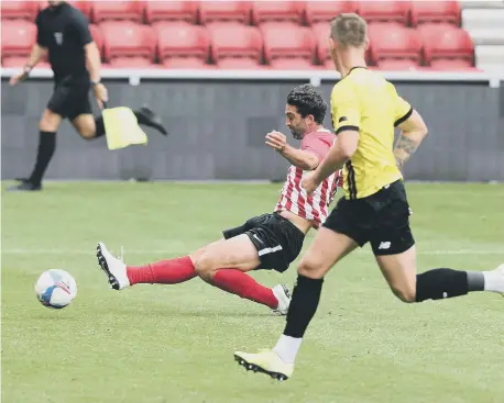  ??  ?? Will Grigg scores Sunderland’s winning goal against Harrogate