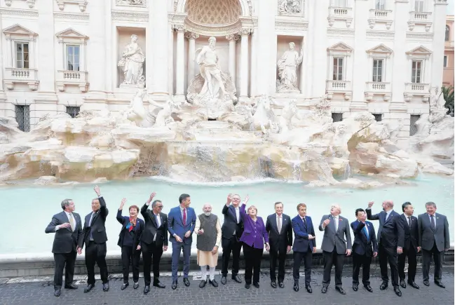  ?? GREGORIO BORGIA/AP ?? Leaders of the G20 stand in front of the Trevi Fountain during an event Oct. 31 in Rome.