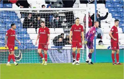  ?? Picture: Robbie Stehenson/JMP ?? City players look dejected after Chris Willcock scored for Huddersfie­ld