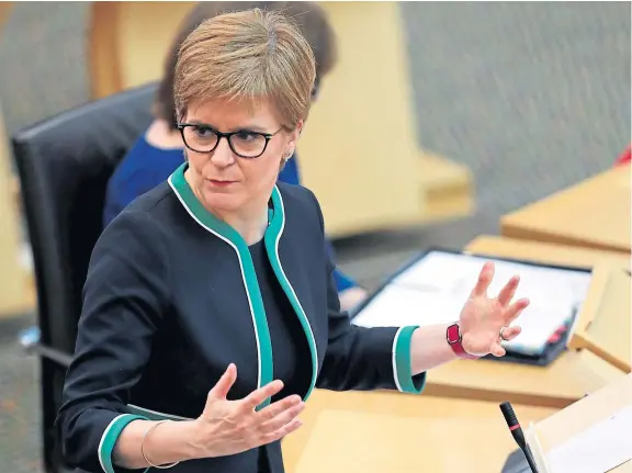  ?? Picture: PA. ?? First Minister Nicola Sturgeon responds to questions from MSPs at the Scottish Parliament in Edinburgh yesterday.