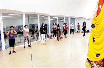  ?? SUPPLIED ?? Princella (far right) from Pakistan teaches Bollywood dance in her studio.