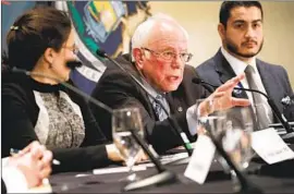  ?? Scott Olson Getty Images ?? BERNIE SANDERS campaigns in Detroit on Monday. Michigan — where Sanders trails Joe Biden in polls — and five other states hold primaries on Tuesday.