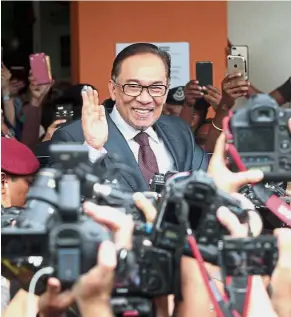  ??  ?? A long saga: Anwar walking out a free man after his royal pardon in May. Trowell first acted as an internatio­nal observer at Anwar’s trial in 2008.