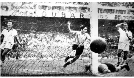  ?? AP ?? Sealing it: Uruguay’s Alcides Edgardo Ghiggia scores the winning goal against Brazil.