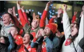  ?? ORLIN WAGNER — THE ASSOCIATED PRESS ?? Kansas City Chief fans celebrate a fourth quarter Super Bowl touchdown in Kansas City, Mo., Sunday.