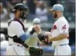  ?? TONY DEJAK — ASSOCIATED PRESS ?? Yan Gomes congratula­tes Cody Allen after the Indians’ victory over the Twins on June 17.