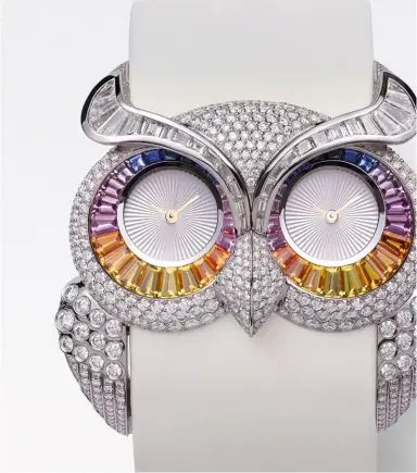  ??  ?? Owl watch in white gold set with sapphires and diamonds by Chopard