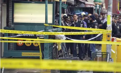  ?? ?? The entrance to the 36th Street subway stop following the shooting in Brooklyn, New York, on 12 April 2022. Photograph: John Minchillo/AP